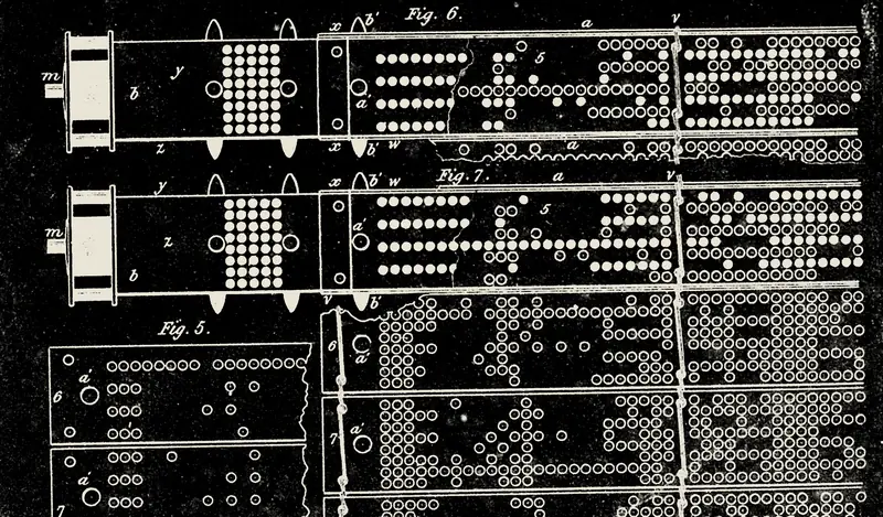 Nineteenth-century engraving of punched cards for a Jacquard loom: rows of holes that told the machine which threads to lift.
